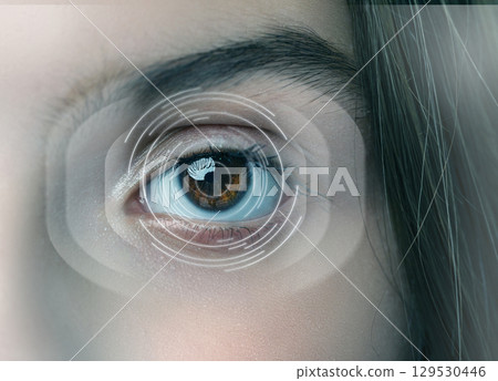 Close-up view of an eye showcasing vibrant colors and digital graphics representing technology in vision at a studio 129530446