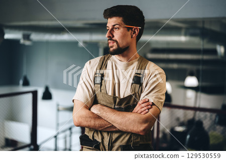 Skilled handyman works on home renovation project in modern indoor setting using power tools and organized workspace Skilled handyman works on home renovation project in modern indoor setting using power tools and organized workspace 129530559