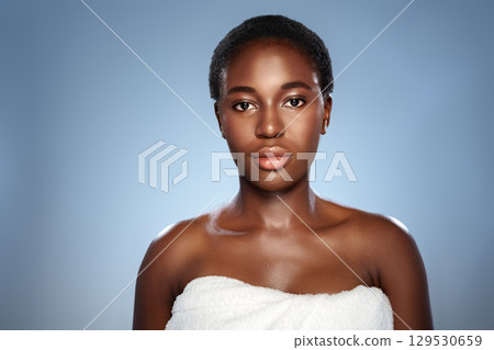 Portrait of a woman with natural beauty in a studio setting showcasing her confidence and poise 129530659