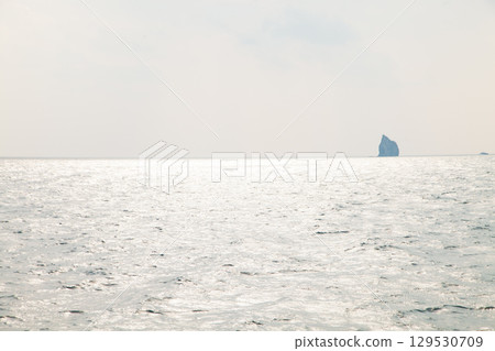 An island floating in the sea An island floating in the sea 129530709