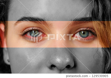 Close-up portrait of a person with striking blue eyes and grayscale effects in a creative artistic representation Close-up portrait of a person with striking blue eyes and grayscale effects in a creative artistic representation 129530905