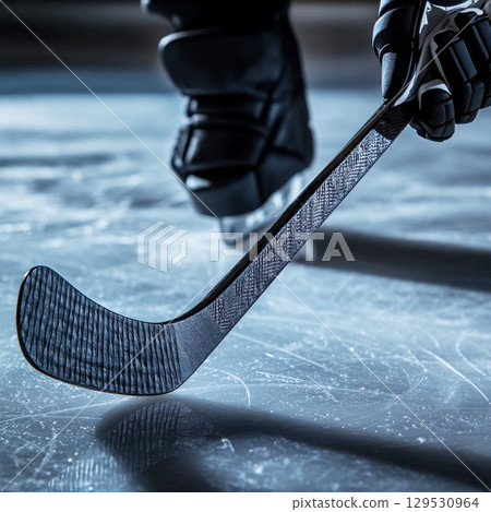 ice hockey stick on ice 129530964
