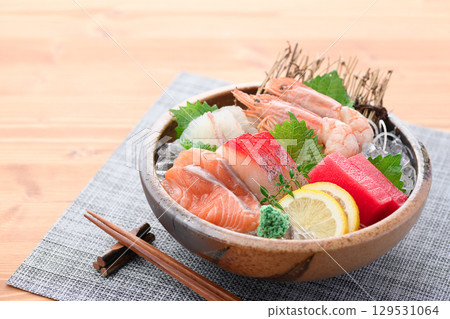 A luxurious sashimi platter with plenty of fresh seafood and sake. High-quality food photos perfect for banquets and menus. A luxurious sashimi platter with plenty of fresh seafood and sake. High-quality food photos perfect for banquets and menus. 129531064