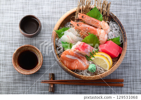 A luxurious sashimi platter with plenty of fresh seafood and sake. High-quality food photos perfect for banquets and menus. A luxurious sashimi platter with plenty of fresh seafood and sake. High-quality food photos perfect for banquets and menus. 129531068