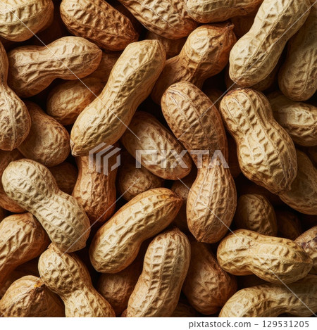 A close-up view of processed peanuts arranged as a background or texture 129531205