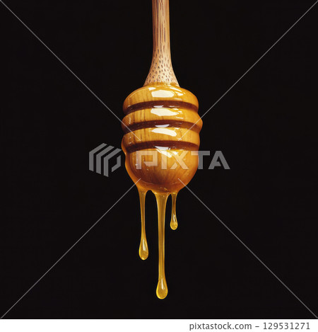Honey dripping from a wooden dipper isolated 129531271