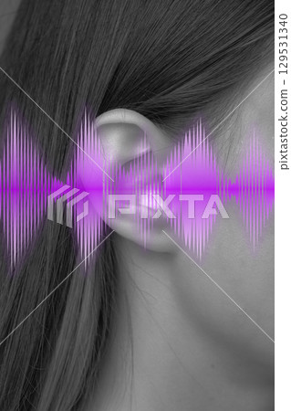Sound wave visualization around a woman ear highlighting audio perception in a creative art representation Sound wave visualization around a woman ear highlighting audio perception in a creative art representation 129531340