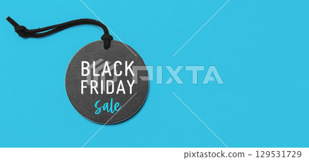 Black friday sale on black price tag on blue background 129531729