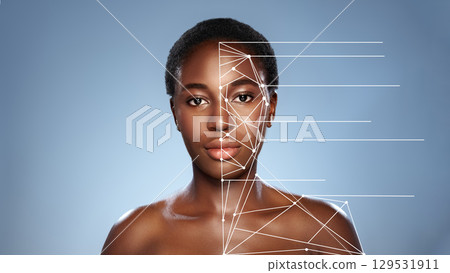 Face analysis showcasing digital overlay on a model's facial features in a studio setting 129531911