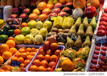 Colorful variety of fresh fruits displayed at a market in the evening light Colorful variety of fresh fruits displayed at a market in the evening light 129531983