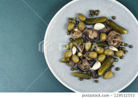 Plate with salty snacks. Plate with salty snacks. 129532553