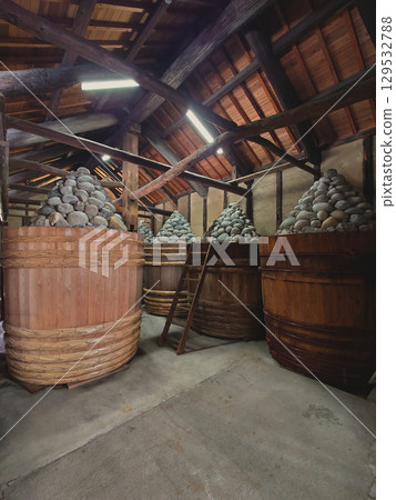 MISO barrel in MISO warehouse / Japanese kura-zukuri (warehouse construction) - The interior of a miso storehouse and miso barrels MISO barrel in MISO warehouse / Japanese kura-zukuri (warehouse construction) - The interior of a miso storehouse and miso barrels 129532788