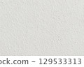 Close-Up View of a Textured White Background Emphasizing Subtle Variations 129533313