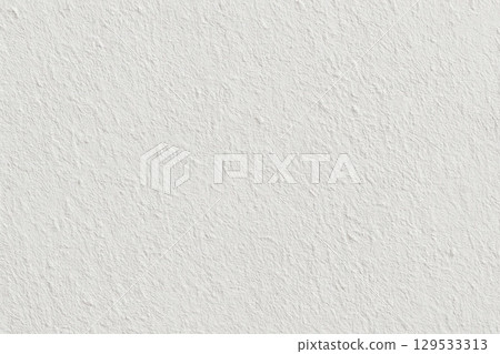 Close-Up View of a Textured White Background Emphasizing Subtle Variations 129533313