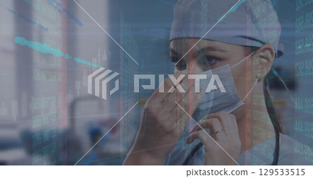 Image of data processing over caucasian female doctor with face mask Image of data processing over caucasian female doctor with face mask 129533515
