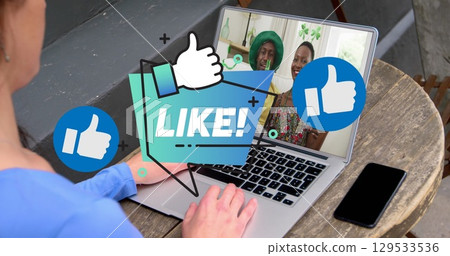 Like text banner and icons over caucasian woman having a imagecall on laptop at a cafe 129533536