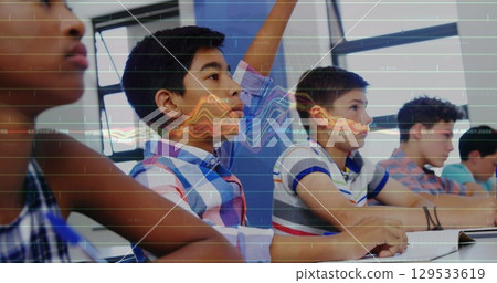 Image of financial graph over class of diverse boys learning at school 129533619