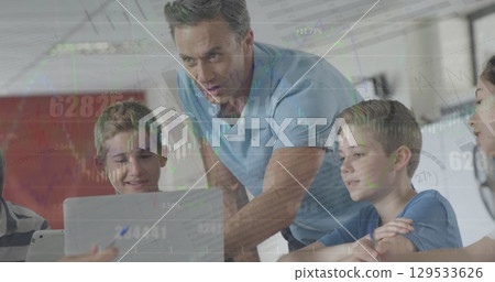 Image of graph over caucasian male teacher and class of diverse pupils using laptop 129533626