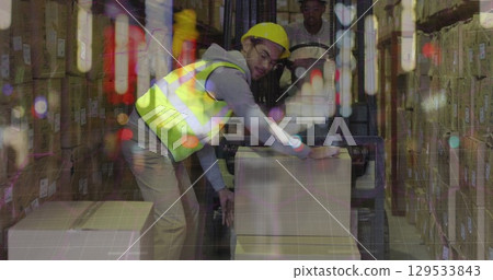 Image of caucasian male warehouse worker over blurred night city 129533843