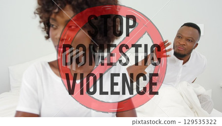 Image of stop domestic violence text over african american couple arguing 129535322
