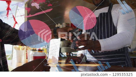Image of data processing over african american man paying with credit card 129535325