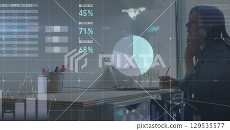 Image of statistics and data processing over businessman using laptop 129535577