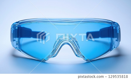 Bright blue protective goggles are displayed against light background ideal for safeguarding eyes during sports construction or laboratory tasks. Their stylish design complements practical use. Bright blue protective goggles are displayed against light background ideal for safeguarding eyes during sports construction or laboratory tasks. Their stylish design complements practical use. 129535818