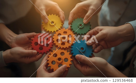 Teamwork in Action: Colorful Interlocking Gears 129536468