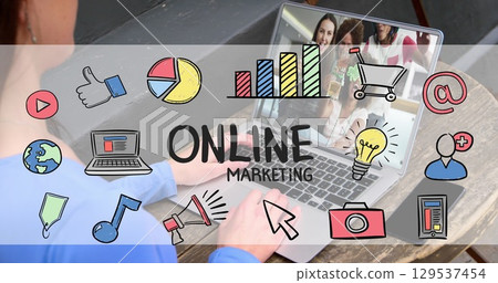 Image of online marketing text and icons over caucasian woman using laptop Image of online marketing text and icons over caucasian woman using laptop 129537454