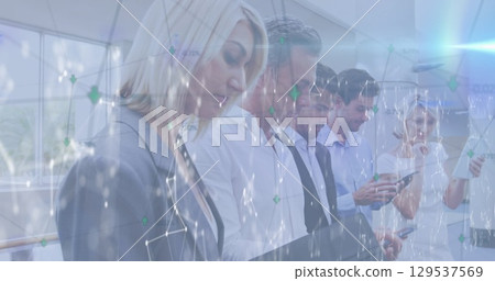 Image of connections and lights over caucasian businesspeople using tech devices 129537569