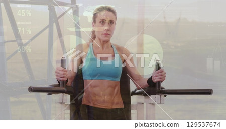 Image of graphs over caucasian woman exercising at gym 129537674