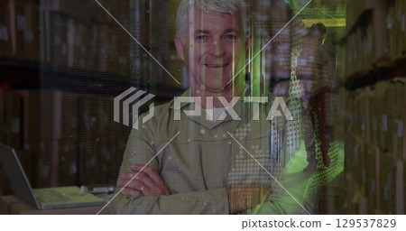 Image of globe over happy senior caucasian male warehouse worker Image of globe over happy senior caucasian male warehouse worker 129537829