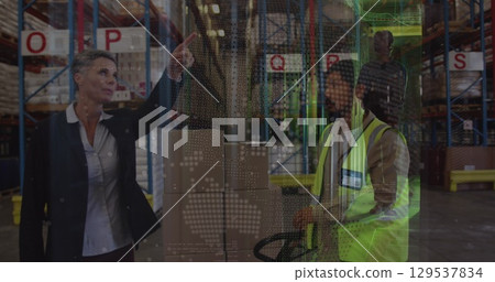 Image of globe over diverse female and male warehouse workers and road traffic Image of globe over diverse female and male warehouse workers and road traffic 129537834