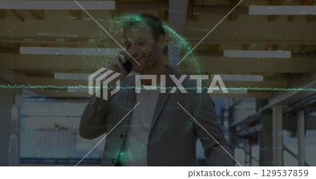 Image of graphs and globe over caucasian businessman using smartphone 129537859