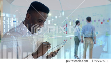 Image of financial data processing over diverse group of business people Image of financial data processing over diverse group of business people 129537892