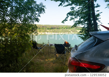 Lakeside Camping Retreat with Car and Chairs Lakeside Camping Retreat with Car and Chairs 129538052