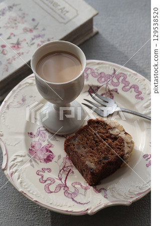 Carrot cake topped with almonds 129538520
