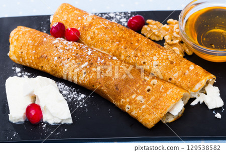 Bulgarian Palachinka crepes with brinsen cheese Bulgarian Palachinka crepes with brinsen cheese 129538582