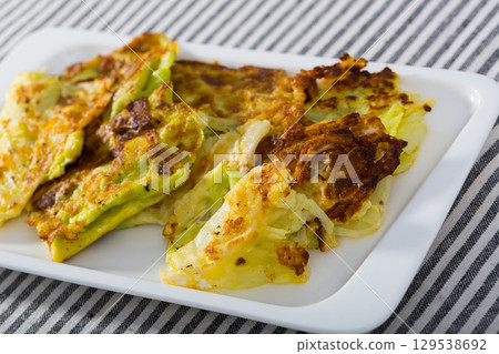 Image of cabbage leaves in batter Image of cabbage leaves in batter 129538692