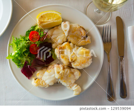 Top view of baked monkfish Top view of baked monkfish 129539094