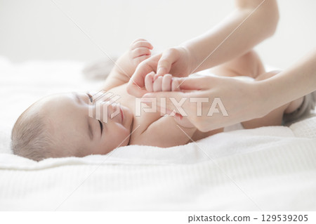 Young mother taking care of her baby 129539205