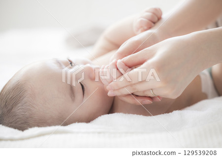 Young mother taking care of her baby 129539208
