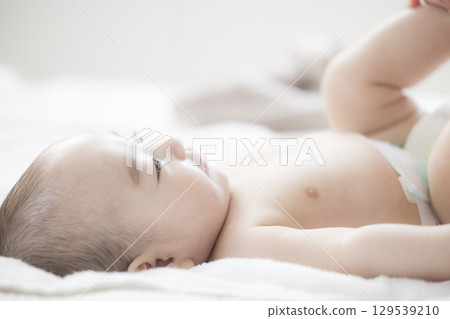 Young mother taking care of her baby 129539210