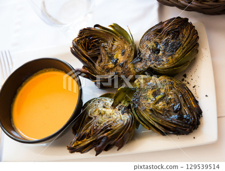 Catalonian dish - grilled artichokes 129539514