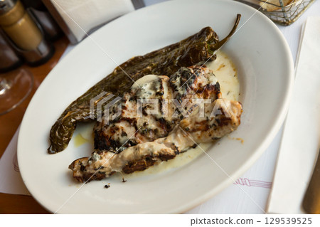 Fried Iberian pork with roquefort sauce Fried Iberian pork with roquefort sauce 129539525