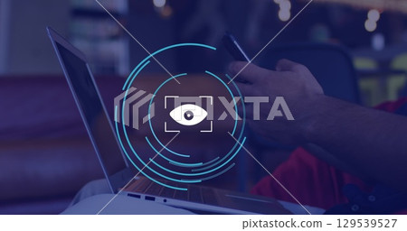Image of eye icon over caucasian businessman using smartphone in office Image of eye icon over caucasian businessman using smartphone in office 129539527