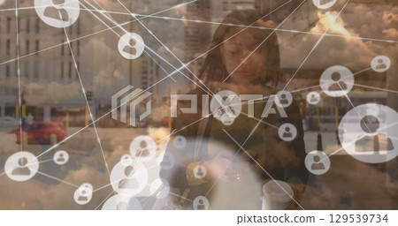 Image of network of connections over clouds and woman walking with coffee 129539734