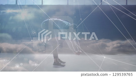 Image of network of connections over african american man exercising 129539765