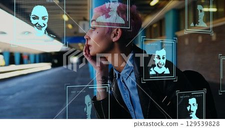 Image of digital profile portraits over caucasian woman with pink hair waiting at station Image of digital profile portraits over caucasian woman with pink hair waiting at station 129539828
