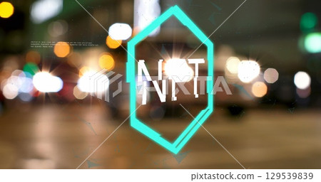 Image of nft logo over defocussed people and traffic on city street at night Image of nft logo over defocussed people and traffic on city street at night 129539839